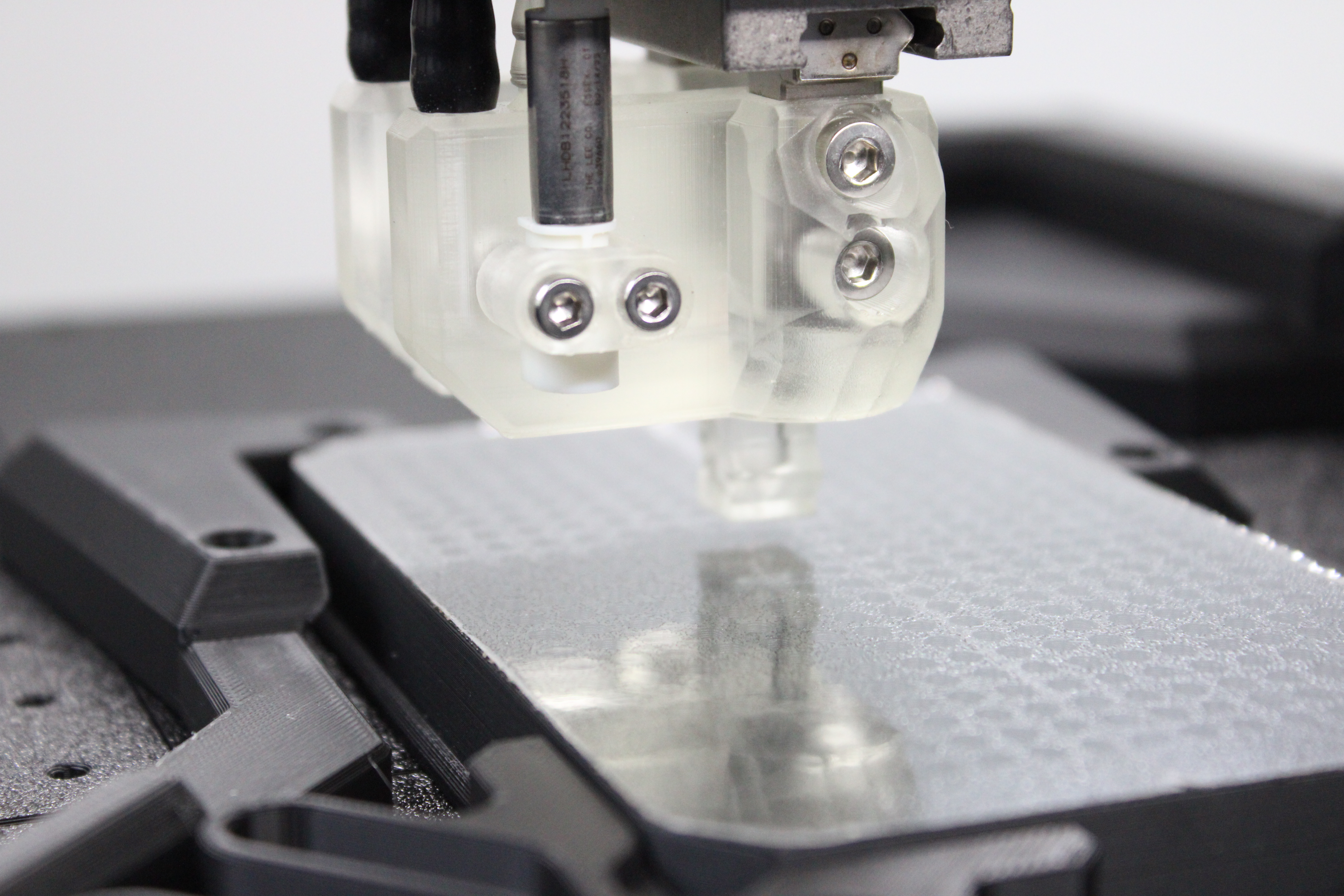 Printer head suspended above a multiwell plate