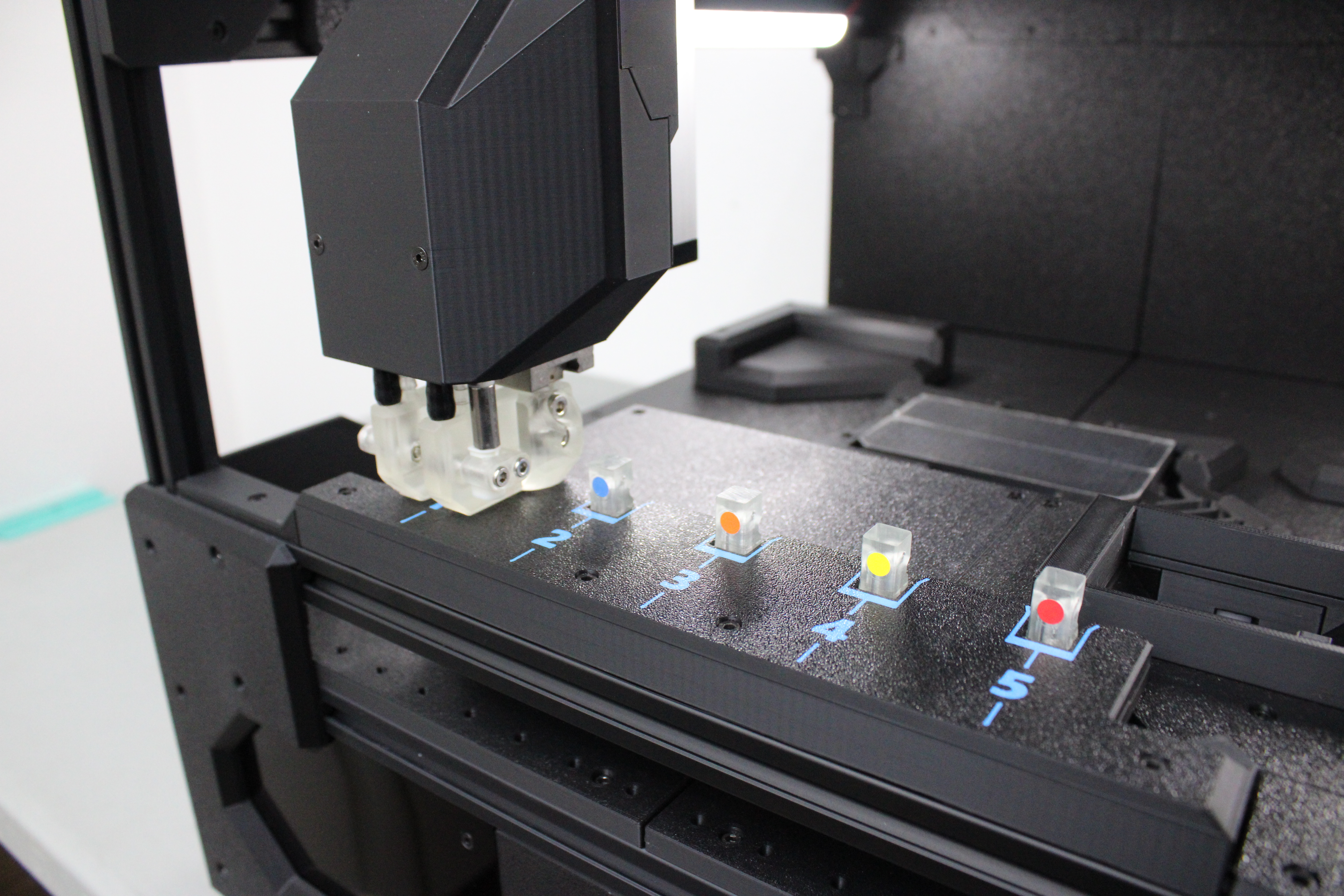 Machine picking up a printer head